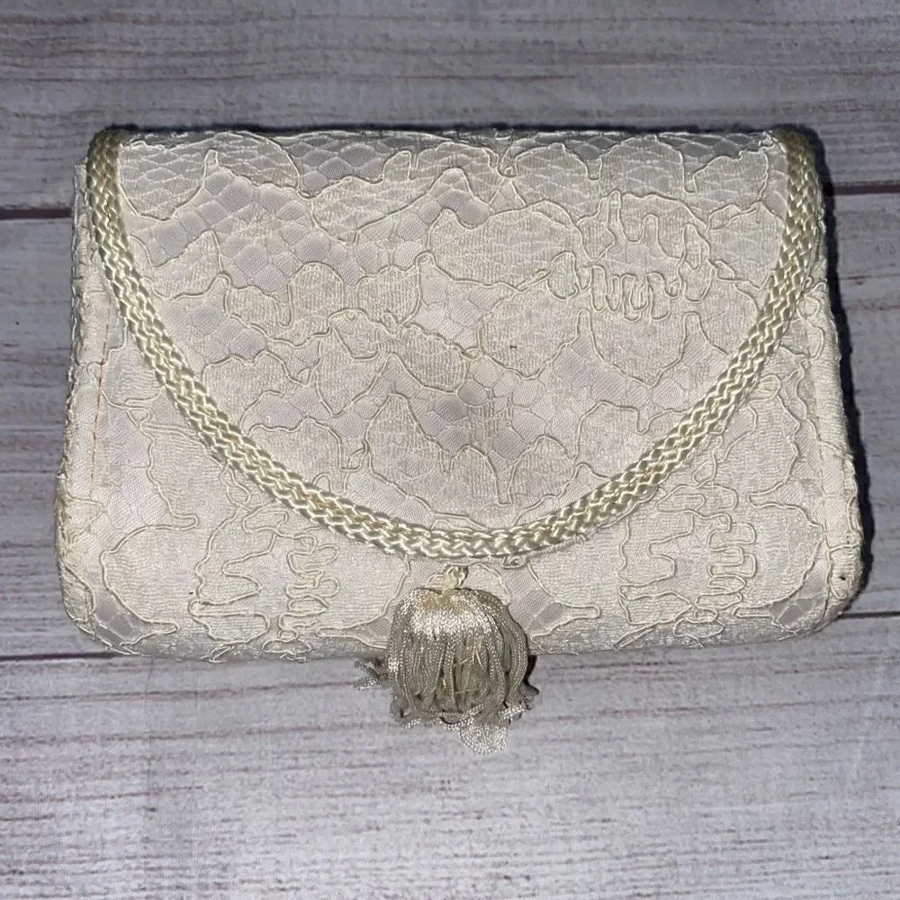 La Regale LTD vintage lace clutch w/nylon chord strap & fringe tassle white
